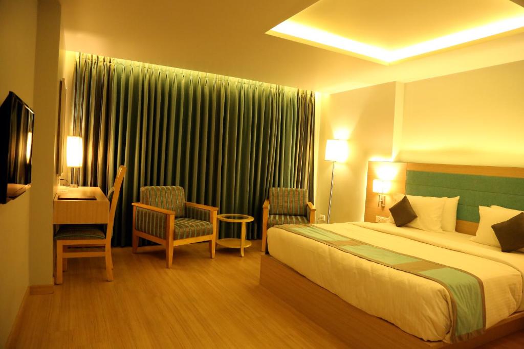 TV a/nebo společenská místnost v ubytování KVM Hotels Srirangam
