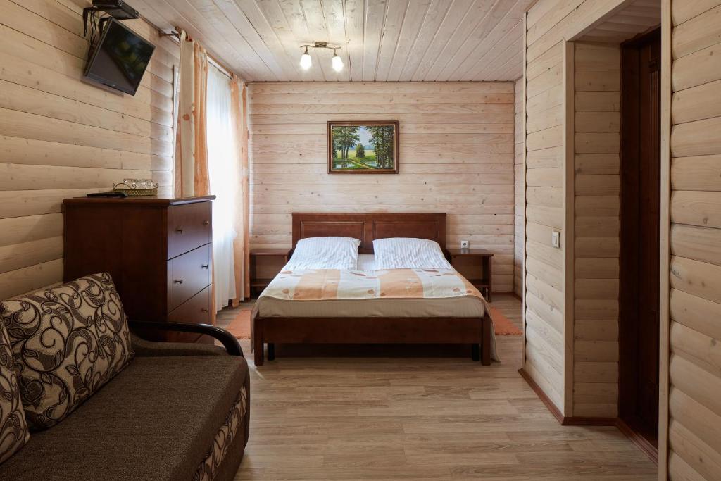Postel nebo postele na pokoji v ubytování Zlata