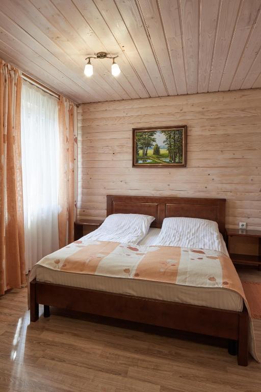 Postel nebo postele na pokoji v ubytování Zlata