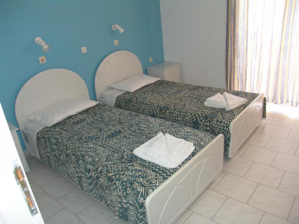 Postel nebo postele na pokoji v ubytování Kontessa Apartments