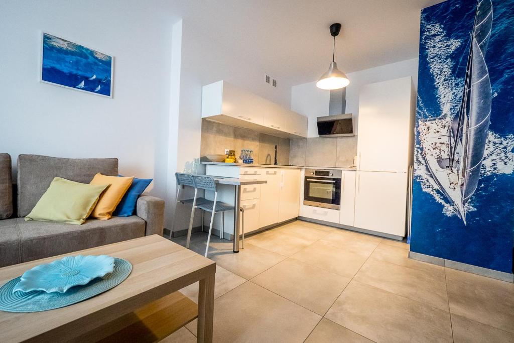 Kuchyňa alebo kuchynka v ubytovaní FUDA APARTAMENT BRUKSELSKA 11