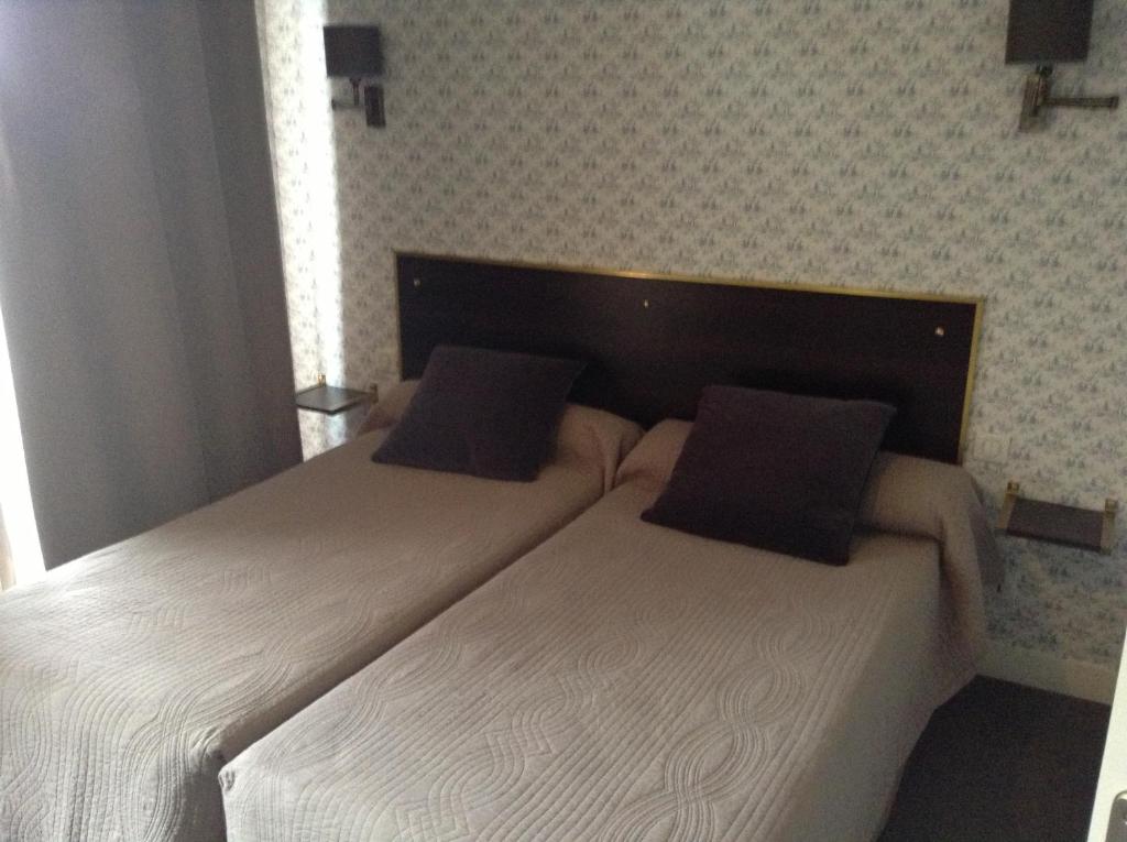 Postel nebo postele na pokoji v ubytování Logis Terrasse Hôtel