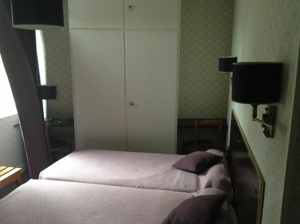 Postel nebo postele na pokoji v ubytování Logis Terrasse Hôtel