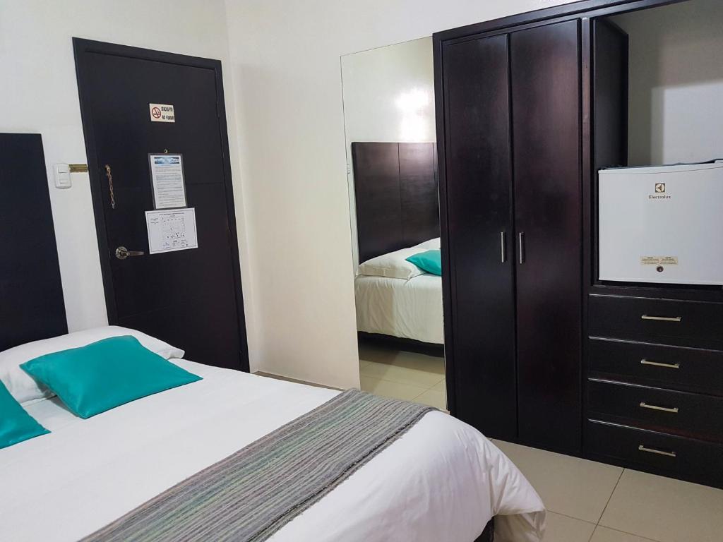 Postel nebo postele na pokoji v ubytování Hostal Blue Pacific