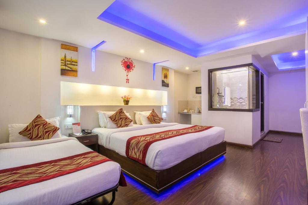 Postel nebo postele na pokoji v ubytování Avataar Kathmandu Hotel