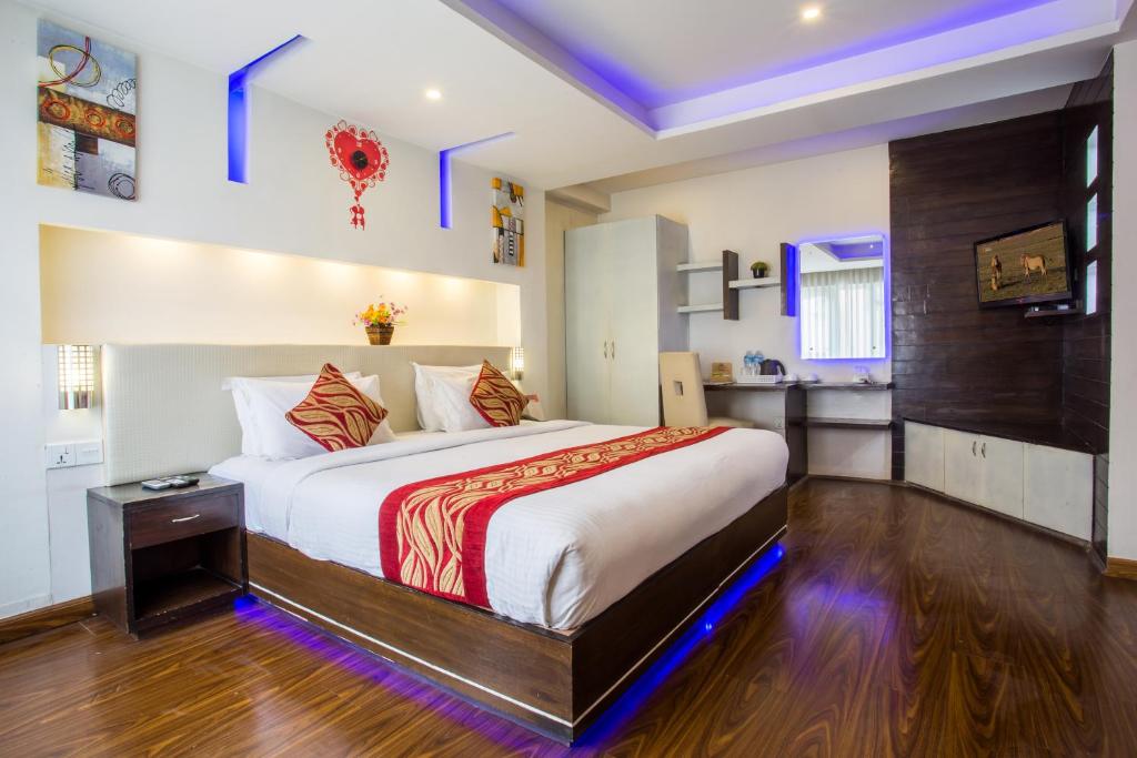 a bedroom with a large bed in a room at Avataar Kathmandu Hotel in Kathmandu