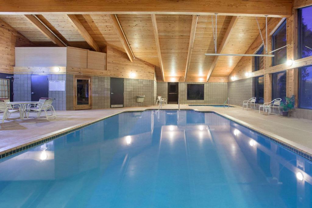 a large swimming pool in a large building at AmericInn by Wyndham White Bear Lake St. Paul in White Bear Lake