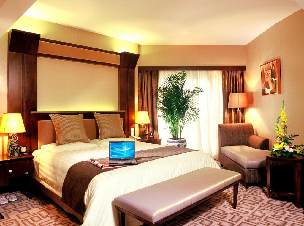 Postel nebo postele na pokoji v ubytování Xiyuan Hotel
