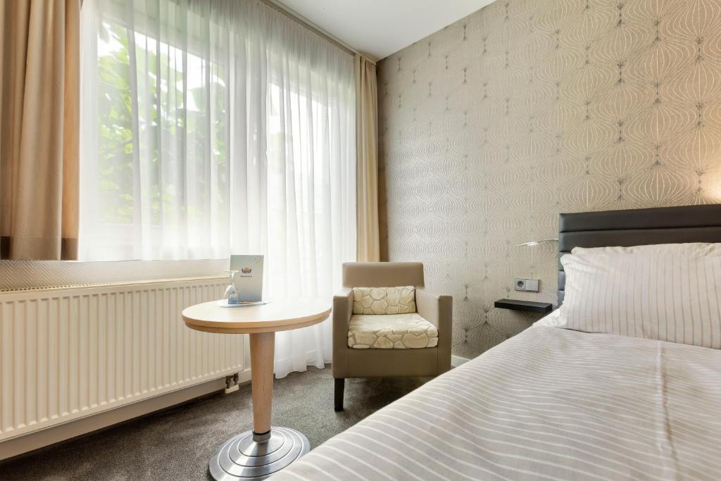 Postel nebo postele na pokoji v ubytování Hotel Hiemann - Superior