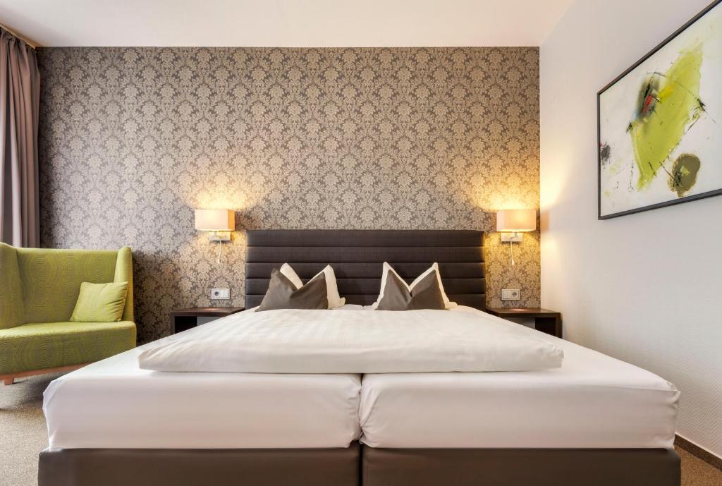 Postel nebo postele na pokoji v ubytování Hotel Hiemann - Superior