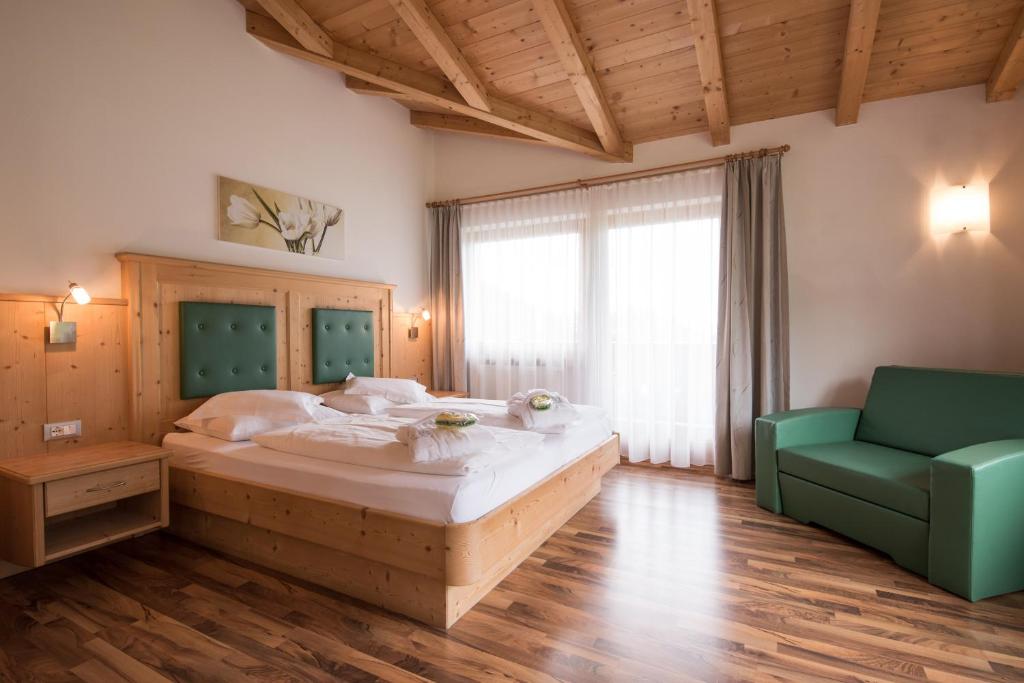Postel nebo postele na pokoji v ubytování Garni Hotel Bel Vert