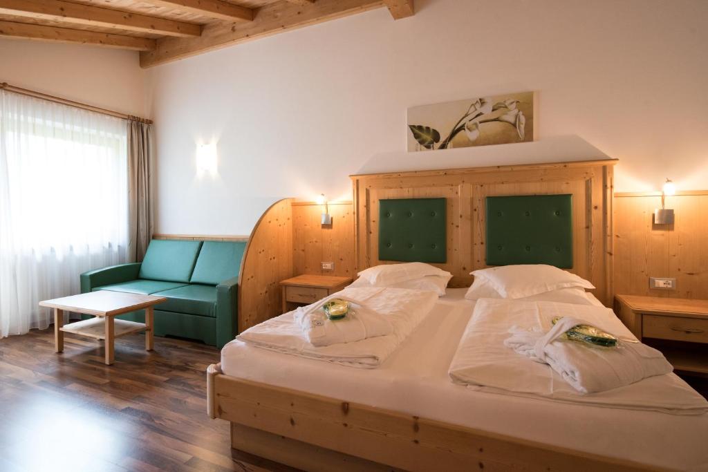 Postel nebo postele na pokoji v ubytování Garni Hotel Bel Vert