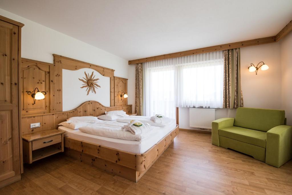 Postel nebo postele na pokoji v ubytování Garni Hotel Bel Vert