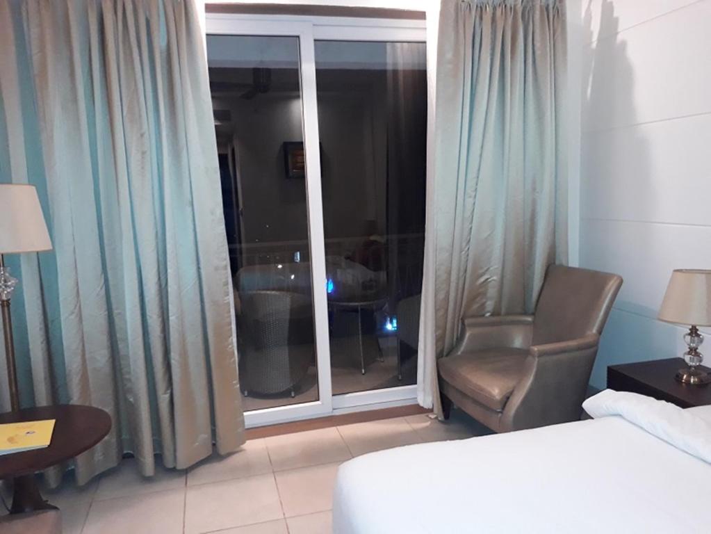 Postel nebo postele na pokoji v ubytování Lemon Tree Hotel Candolim