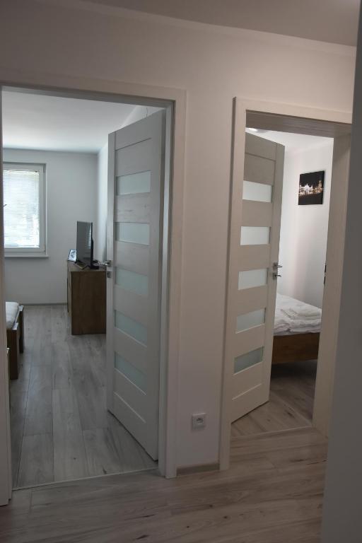 Postel nebo postele na pokoji v ubytování Apartament w Śródmieściu