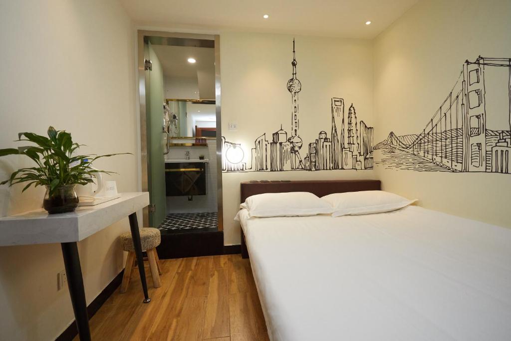 Postel nebo postele na pokoji v ubytování Shanghai Meego Qingwen Hotel