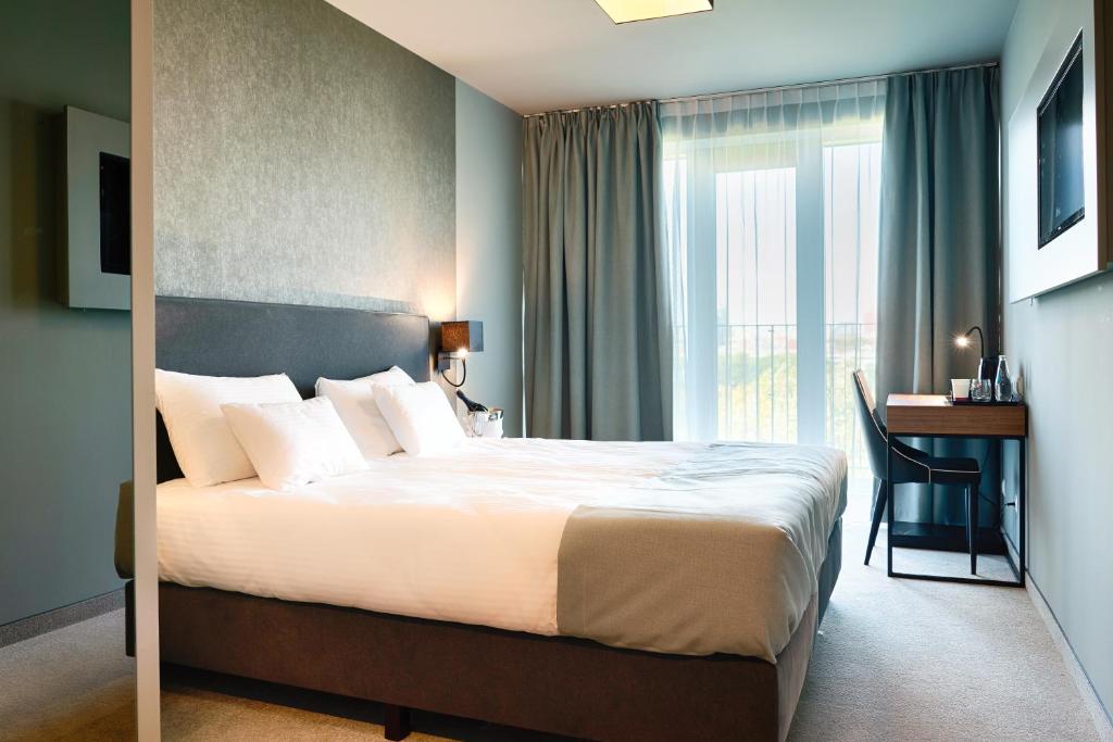 Posteľ alebo postele v izbe v ubytovaní Focus Hotel Poznań