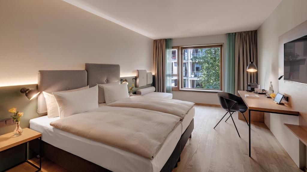 Postel nebo postele na pokoji v ubytování Hotel the YARD Berlin