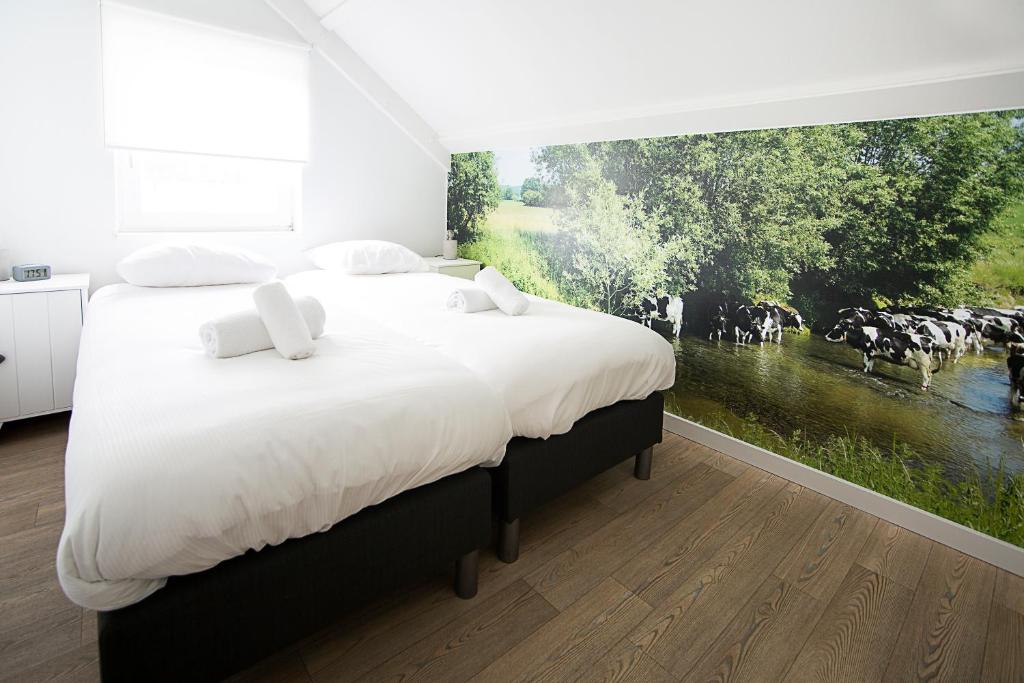 Säng eller sängar i ett rum på Puur Mechelen