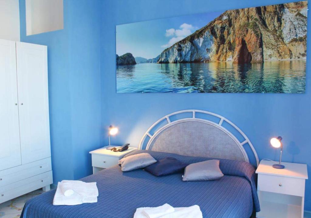 Postel nebo postele na pokoji v ubytování Hotel Ortensia