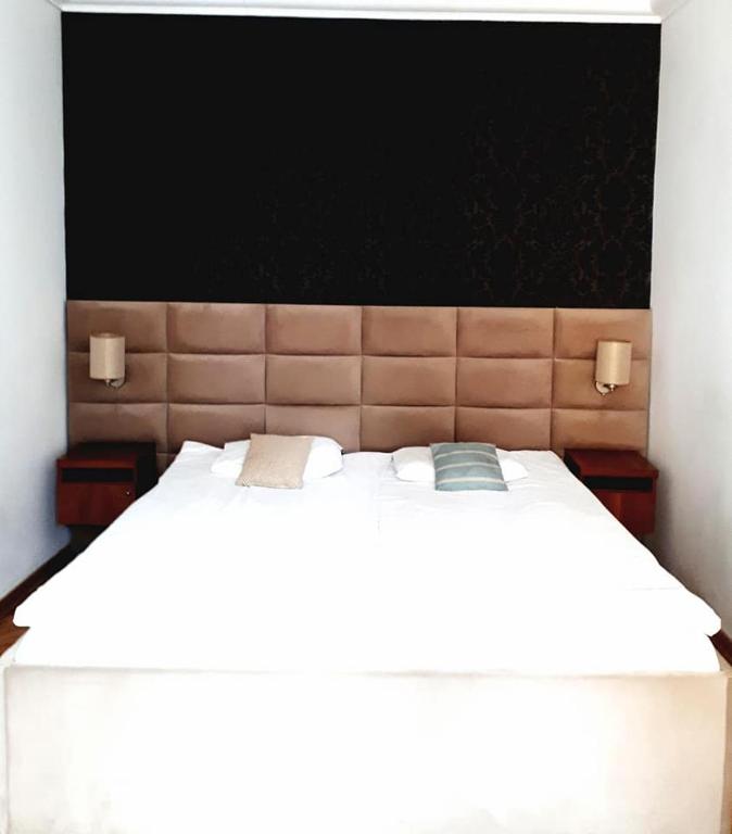 Postel nebo postele na pokoji v ubytování Chmielna 5 Rooms & Apartments
