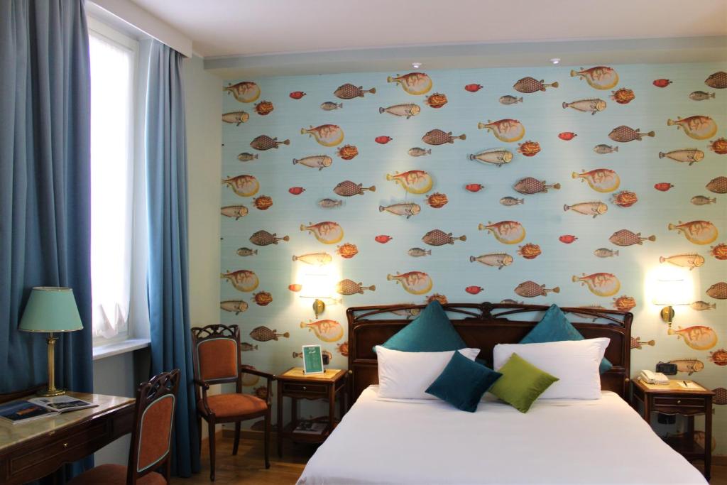 Postel nebo postele na pokoji v ubytování Hotel Continental Genova