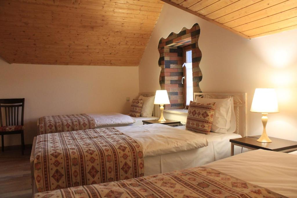 Postel nebo postele na pokoji v ubytování Garni HinYard