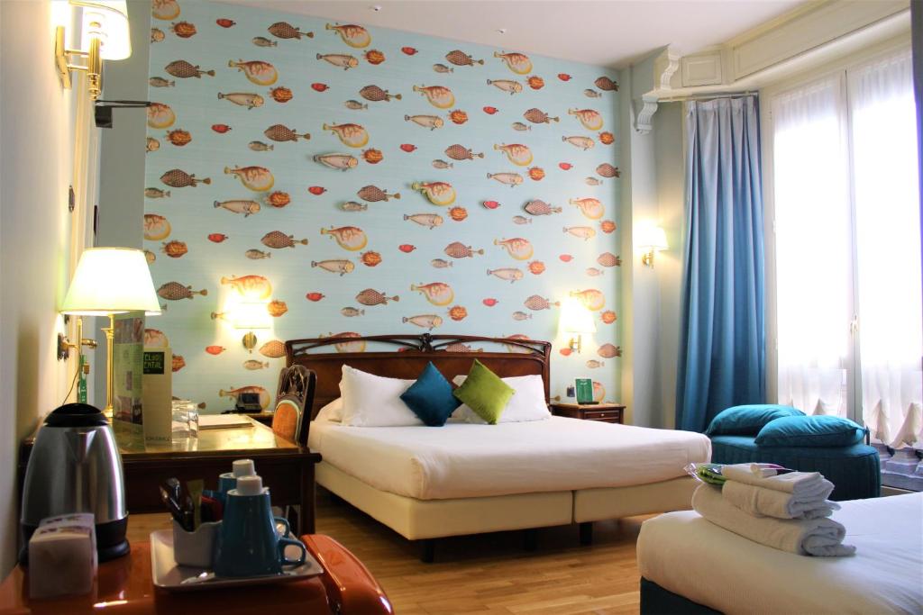 Postel nebo postele na pokoji v ubytování Hotel Continental Genova