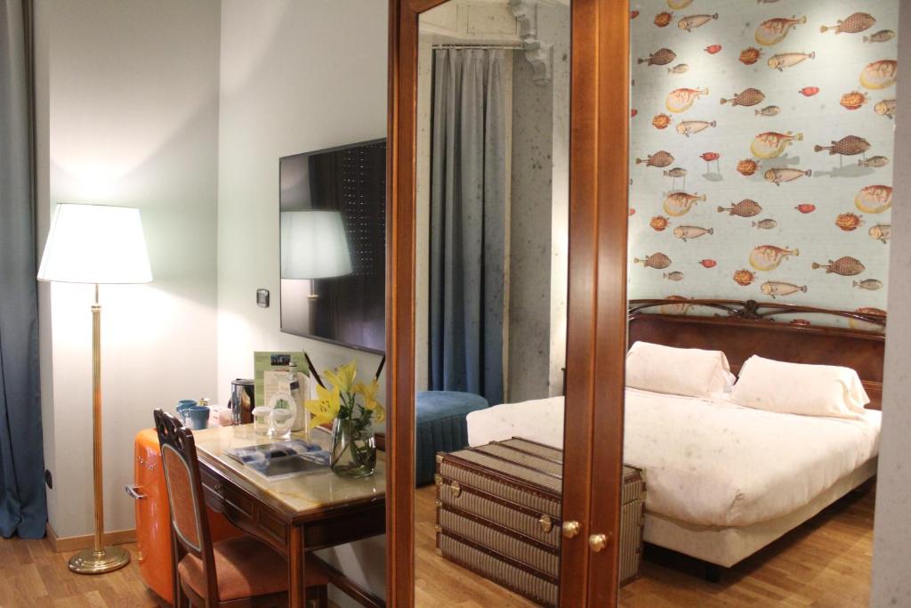 Postel nebo postele na pokoji v ubytování Hotel Continental Genova