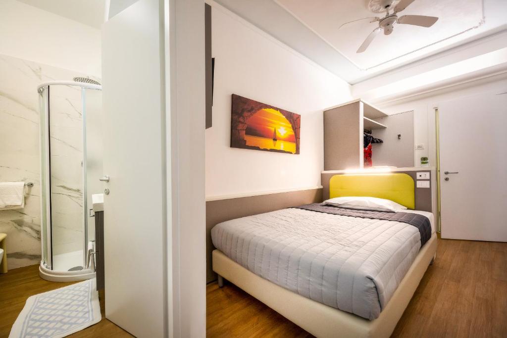 Postel nebo postele na pokoji v ubytování Hotel Danieli
