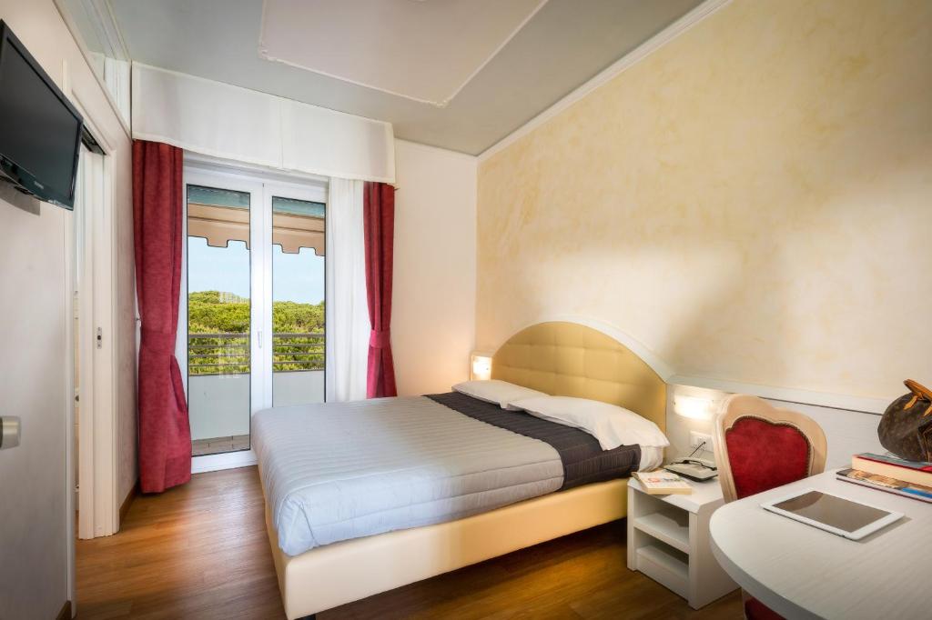 Postel nebo postele na pokoji v ubytování Hotel Danieli