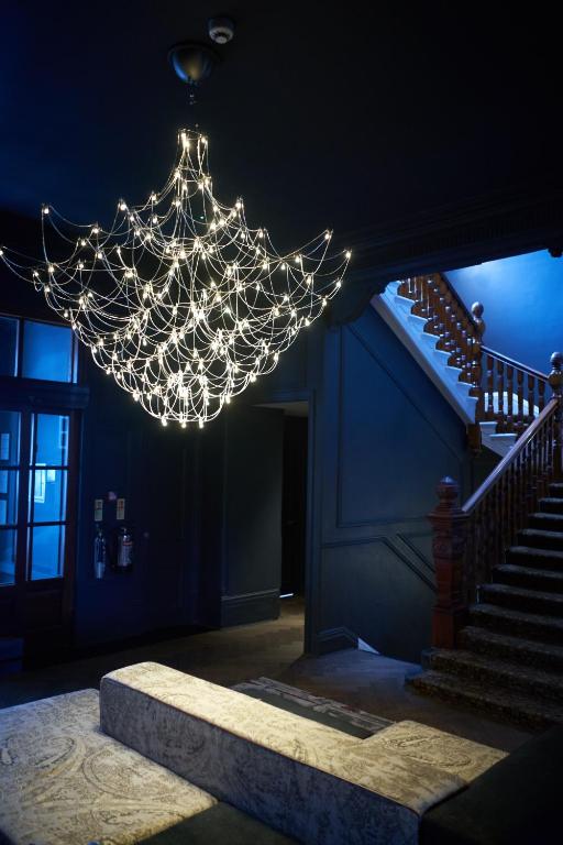 a chandelier in a room with a stair case at Avon Gorge by Hotel du Vin in Bristol