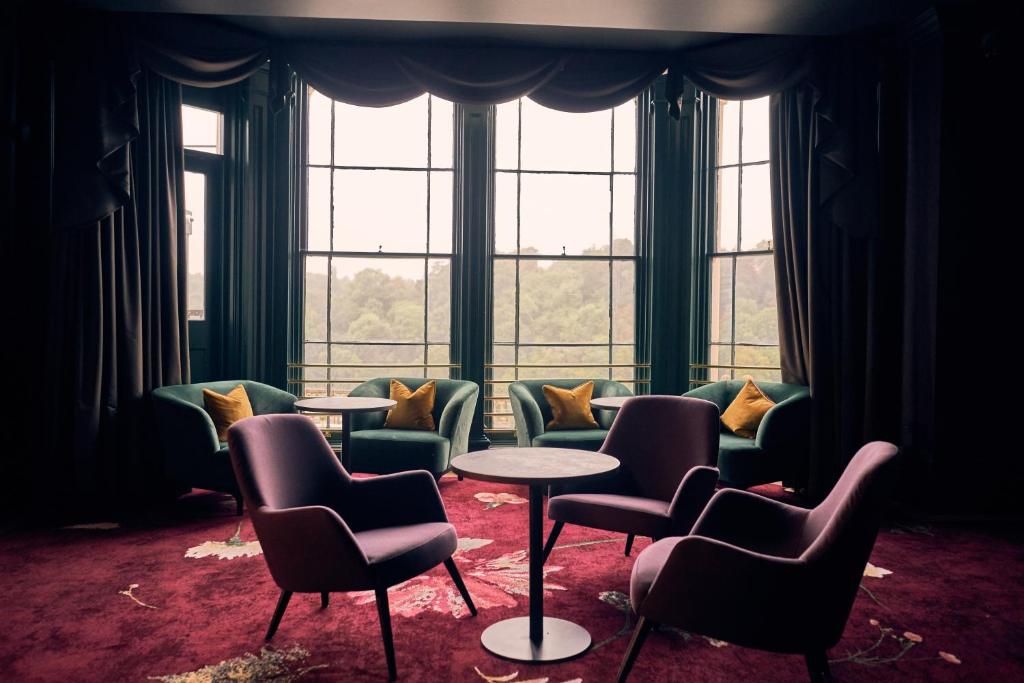 a waiting room with chairs and tables in front of a window at Avon Gorge by Hotel du Vin in Bristol