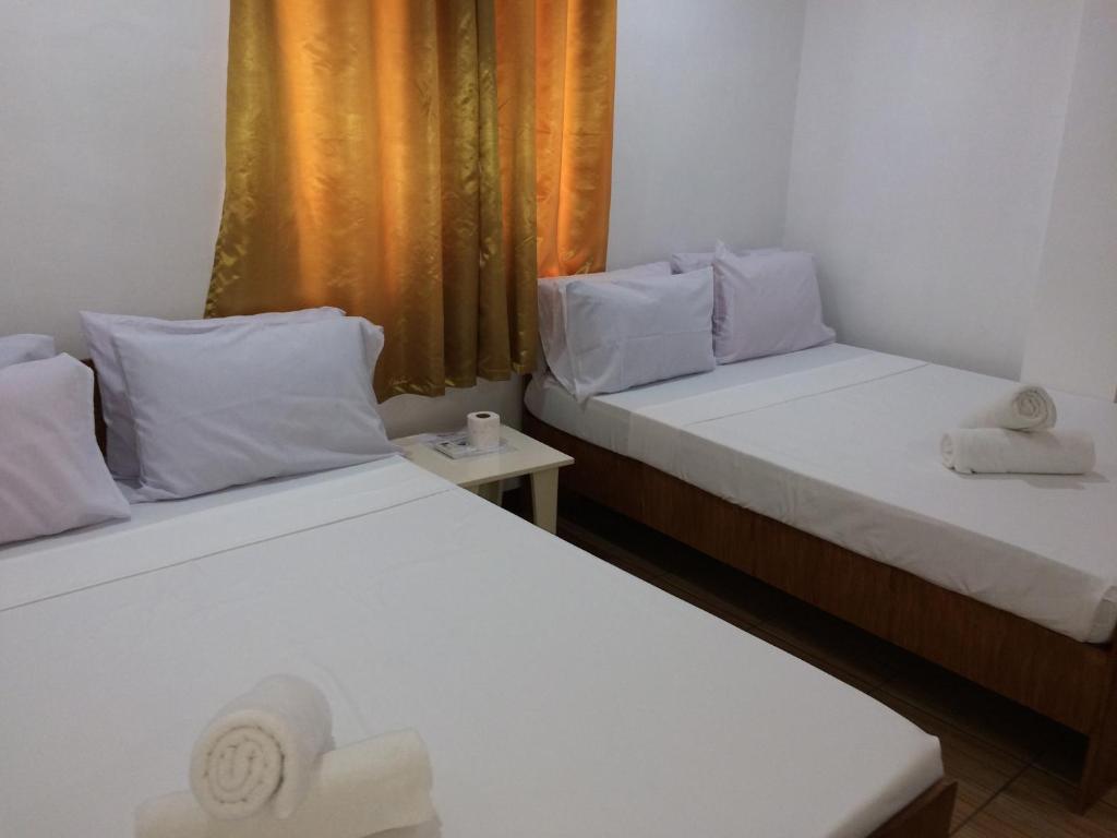 Postel nebo postele na pokoji v ubytování Bella Vita Guest House