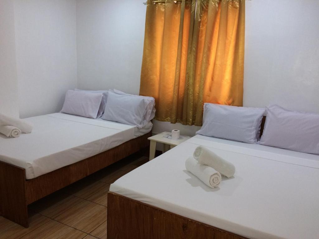 Postel nebo postele na pokoji v ubytování Bella Vita Guest House