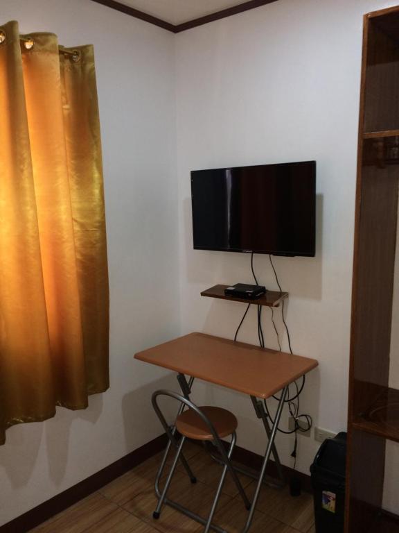 TV a/nebo společenská místnost v ubytování Bella Vita Guest House