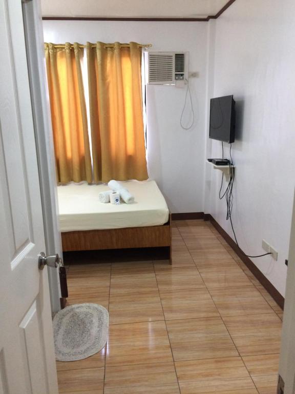 TV a/nebo společenská místnost v ubytování Bella Vita Guest House