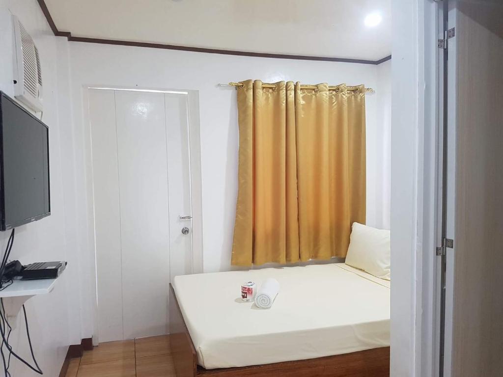 TV a/nebo společenská místnost v ubytování Bella Vita Guest House
