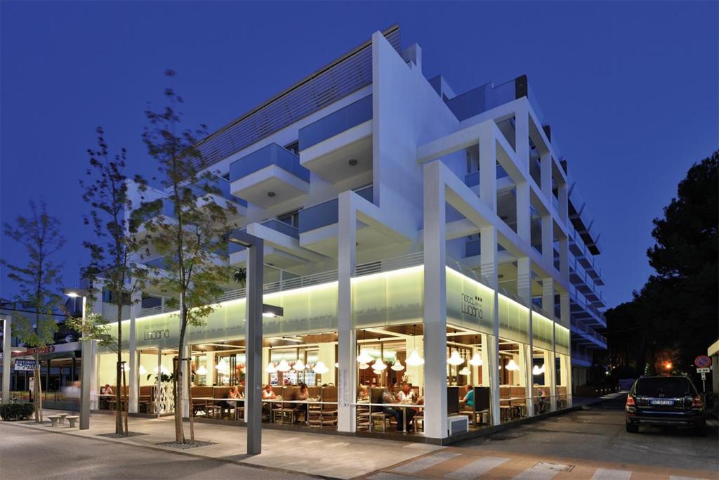 a large white building with a lot of windows at Hotel Luciana in Bibione