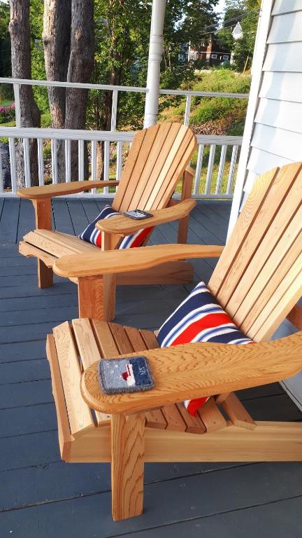 two rocking chairs on a porch with a remote control at Hillside Landing B&B in Digby