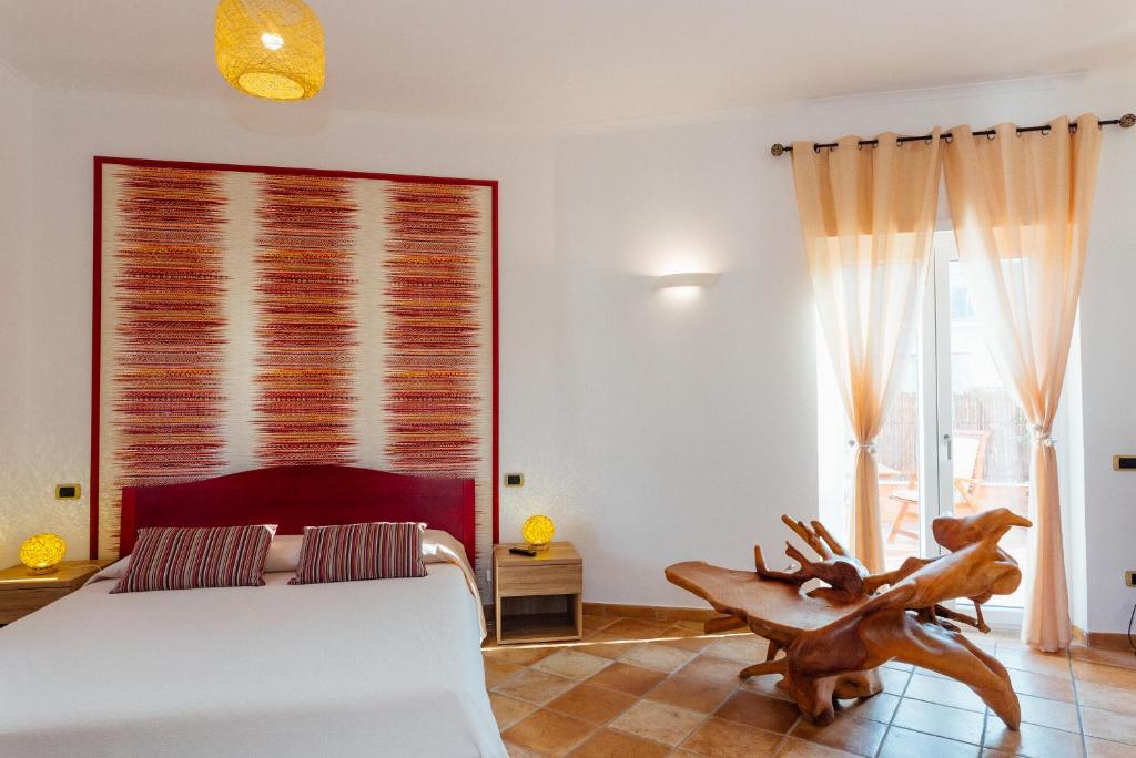 Postel nebo postele na pokoji v ubytování Vista Mare B&B