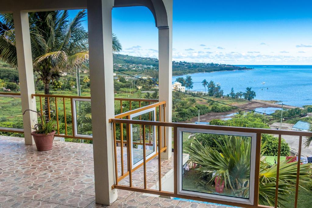 a balcony with a view of the ocean at La Terrasse in Rodrigues Island