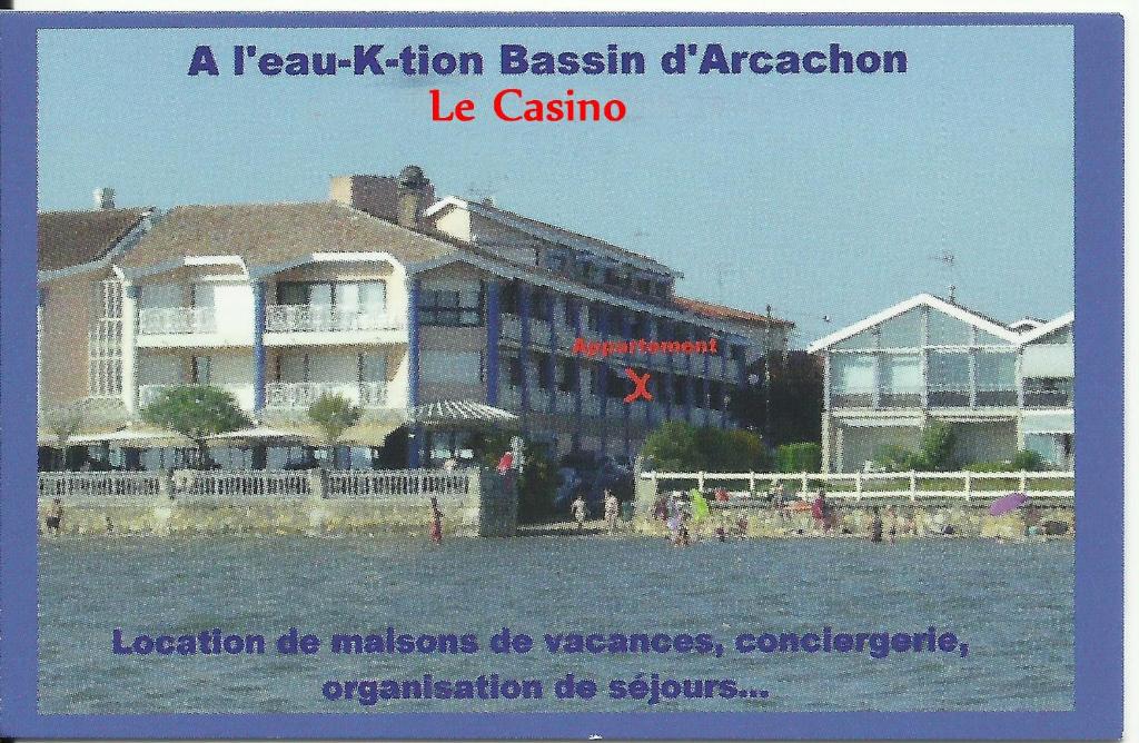 a book with a picture of a building at Résidence Casino in Andernos-les-Bains