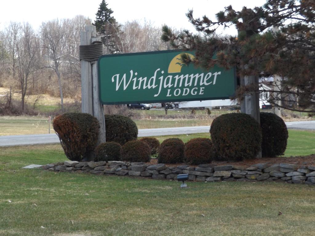 a sign for a windmill lumber lodge on the side of a road at Windjammer Lodge in Ogdensburg