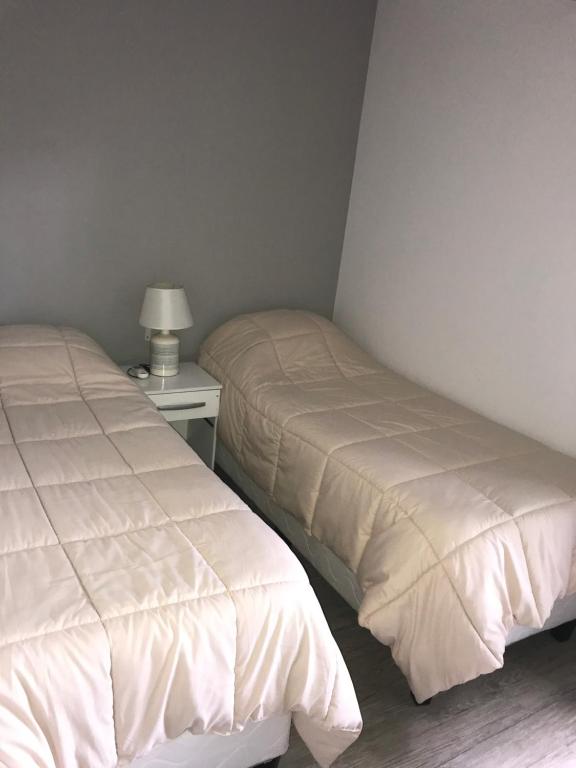 Postel nebo postele na pokoji v ubytování Resort 77