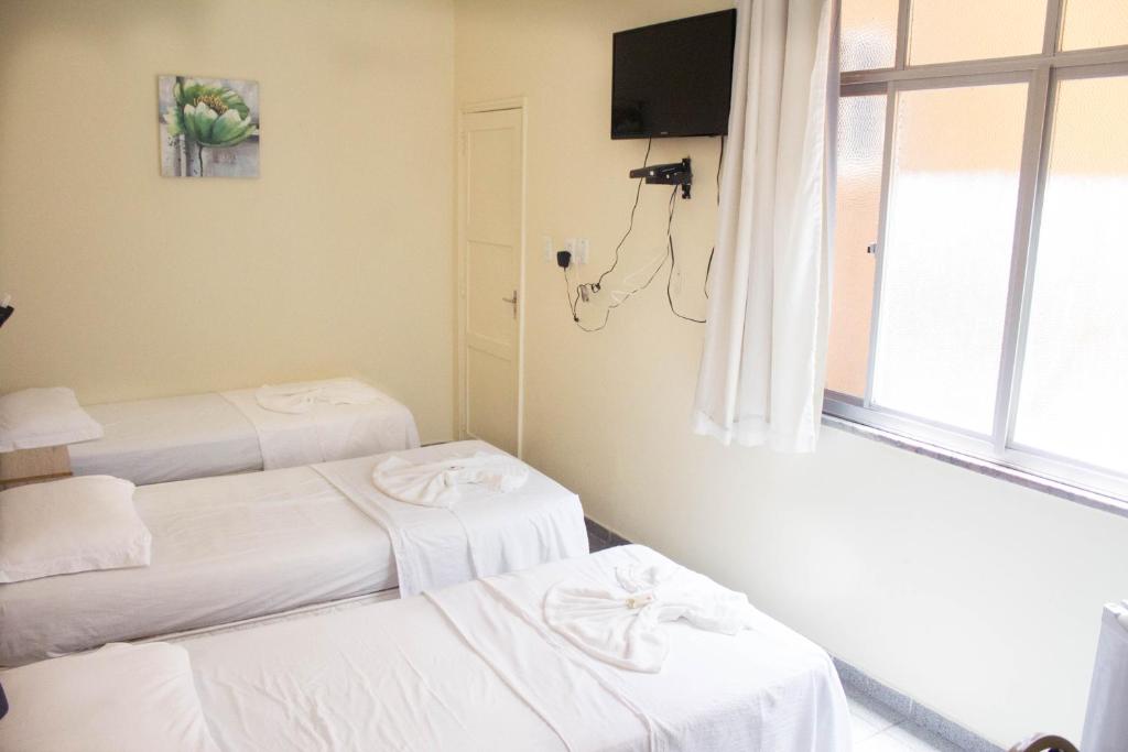 Postel nebo postele na pokoji v ubytování Hotel Central Gold
