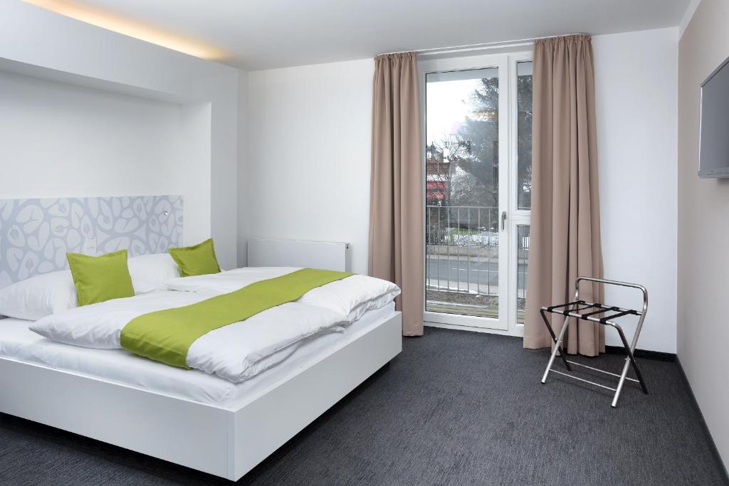 Voodi või voodid majutusasutuse MARA Hotel toas