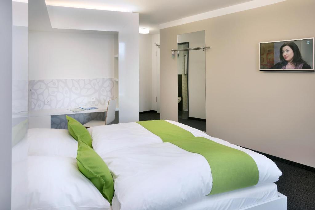 Voodi või voodid majutusasutuse MARA Hotel toas
