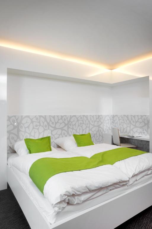 Voodi või voodid majutusasutuse MARA Hotel toas