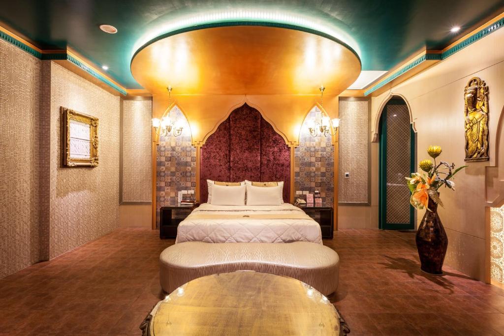 Postel nebo postele na pokoji v ubytování Ouwei Motel